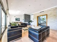 Large modern villa with indoor and outdoor pool sauna and bar.