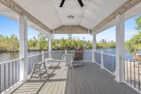 Luxury riverfront home w/ pool, fishing dock, & boat house w/ lift ! Sleeps 14
