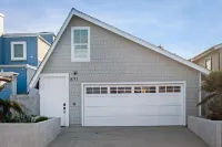 Gorgeous waterfront home with a private hot tub, gas fireplace, & beach access