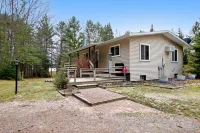 Lakefront Home with a Private Dock, Deck, Fireplace, Spacious Yard, & Playset