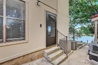 Dog-friendly water view home with inviting porch, AC, W/D, & modern charm