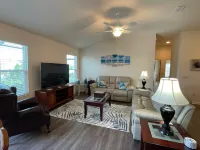 Charming Corner Lot with Golf Cart and Screened Lanai - Inviting Escape