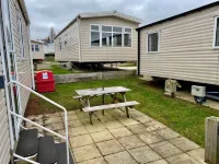Lotus 2 bedroom dog friendly caravan with veranda offers a stunning sea view.