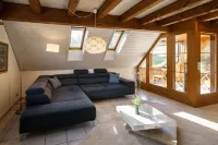 Beautiful penthouse duplex apartment with balcony surrounded by greenery