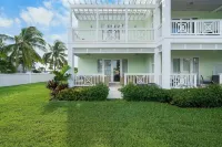 Luxury Beach side escape, steps from private beach, restaurant, marina, and café