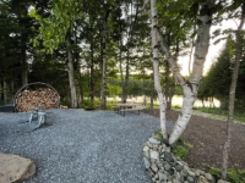 Cozy lakeside glamping dome with fireplace, AC and full bath.