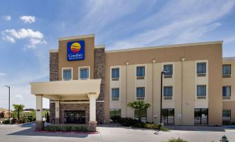 "a modern hotel building with a large entrance and the words "" comfort suites "" on it" at Comfort Inn & Suites Victoria North