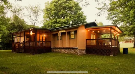 Peaceful Hills Retreat’s cottage is clean and cozy with a creek on 97 acres