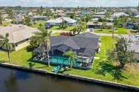 Gulf access pet friendly waterfront oasis with NEW heated salt water pool & spa