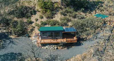 Off-grid tiny home on 6 secluded acres w/ outdoor soaking tubs and sauna!