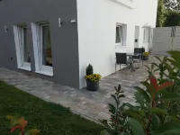 Bright modern apartment in a quiet location with its own entrance and patio