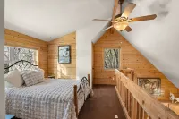 Cozy Log Cabin located on scenic acreage with trees and privacy.