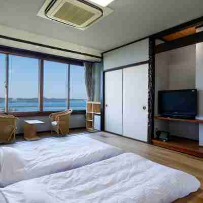 彩花亭酒店 Rooms