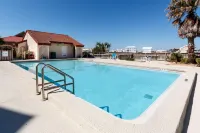 Water view studio with a patio, pool access, and central AC - snowbird friendly