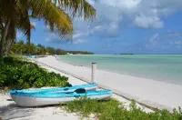 Step from your porch onto the soft white sand & crystal clear water.