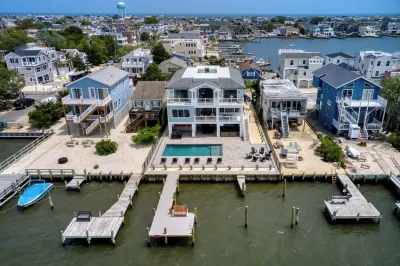 Expansive Bayfront Home w/ Heated Saltwater Pool & Dock Hotels near Island Massage