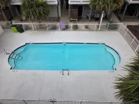 Coastal Comfort: 4-bedroom house with pool and sound access, 3 min walk to beach