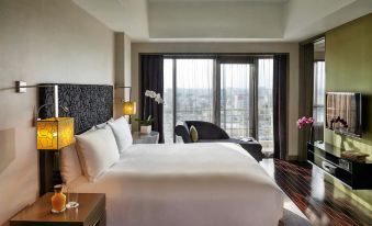 elegant wooden nightstand with a lamp on top, creating a cozy and bright atmosphere in the room at Sofitel Saigon Plaza
