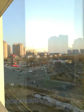 Baiyuan Apartment (Xing'an Street No.1) Отели в г. Цянань