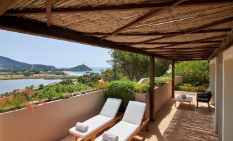 Baia Chia Laguna Resort, Curio Collection by Hilton