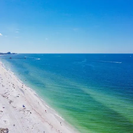 4-Bed Coastal Retreat: Heated Pool, 200 Steps to Beach, Walk to Fun!