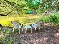 Charming 2-bedroom house with intimate Betsie River setting, AC, and WiFi