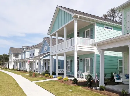 Enjoy sea breezes from double-decker porch -  walk to pool, private waterfront.