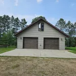 Three bedroom hide-a-way with spacious deck over looking Island Lake.