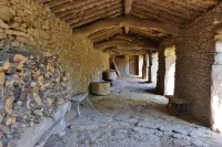 Stone house with garden, barbecue and fireplace.