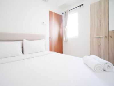 Cozy Living and Tidy 2Br at Puncak Dharmahusada Apartment