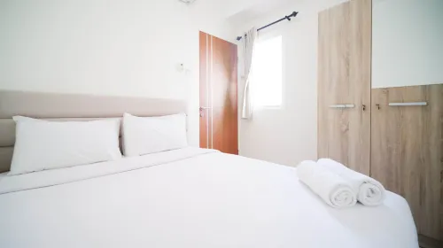 Cozy Living and Tidy 2Br at Puncak Dharmahusada Apartment - Condos