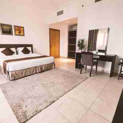 Magnum Hotel & Suites West Bay Rooms