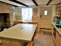 Charming  Listed Thatched Cottage with parking and short walk to sandy beach .