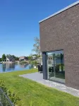Vacation home right on the lake with sauna, air conditioning and private beach Hotels in Barßel