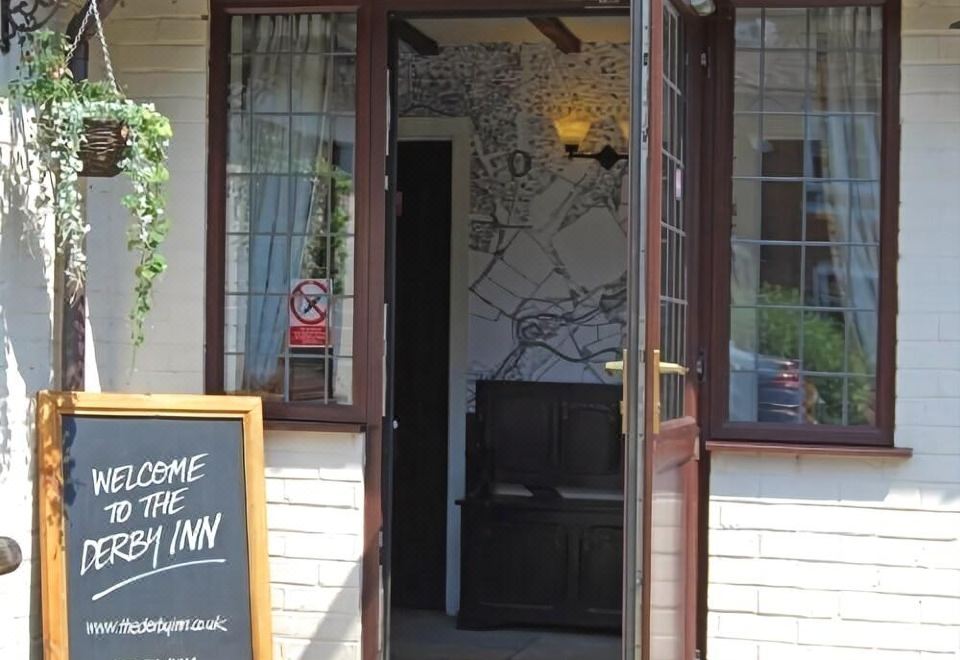 "a restaurant with a sign that reads "" the north inn "" prominently displayed on the front door" at Derby Inn