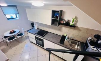 a room with three beds , one on the left , one in the middle , and one on the right at Apartments Ivanisevic