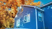 Spacious home near Torch Lake w/custom back patio, steps away from public access