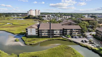 Outdoor Pool and Relaxing Balcony - Charming Coastal Sanctuary Hotels near NMB Nature Trail