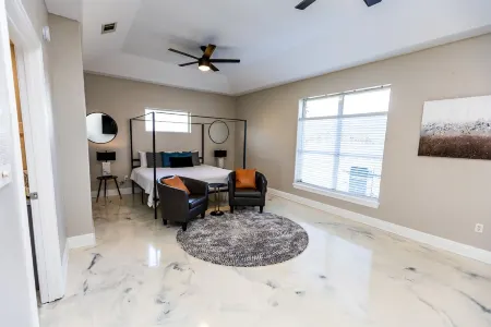 Enjoy this waterfront home with a pool, dock, and Blue Angels! Bring your boat!