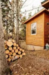 Escape to Tranquility at The Sandy Pearl: A Cozy Log Cottage Retreat