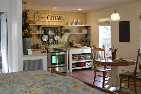 Charming studio cottage on quiet street with beautiful landscaping and gardens.