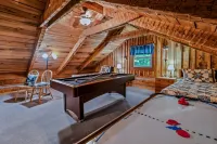 New Song Appalachian Chink Style Cabin Features Foosball and Air Hockey Table by RedAwning