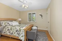 Ideal Lakeshore location in serene wooded landscape with waterfalls.