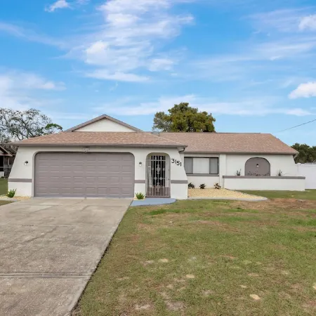 Charming 2-bedroom house with pool and fenced in backyard. Sleeps 8