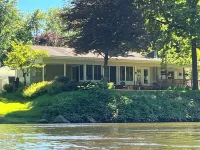 Muskegon River Cottage just steps from the river on a low bank.