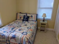 The Lake House at Turtle Cove: Cozy relaxing lake home with dock on wooded lot.