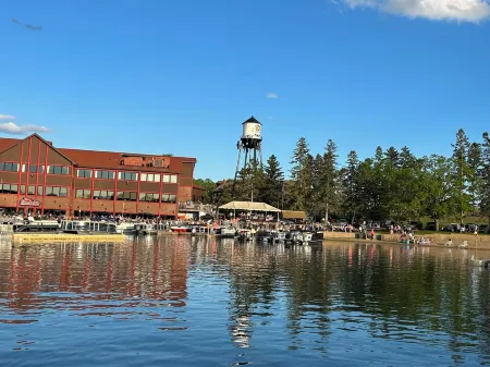 Spacious Summer Escape: Private Backyard, Dock & Fire Pit, Channel Waterfront