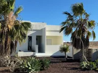 An architectural oasis with large swimming pool, along a breath-taking scenery.