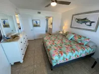 Family beach condo. Steps to sand and restaurants + bars!