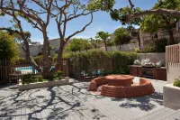 Expansive Oceanfront Patio and Resort-Style Amenities - Charming Coastal Haven